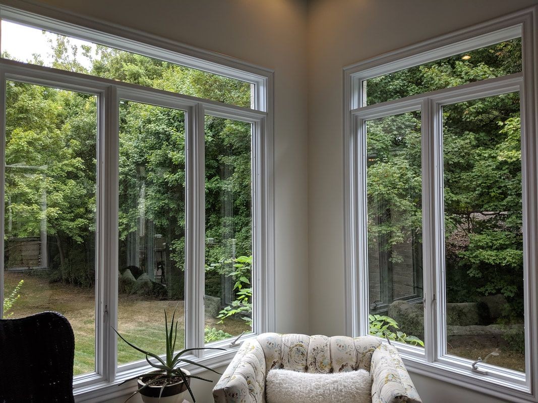 Technician performing professional window cleaning in Michigan. Technician performing professional window cleaning in Michigan.